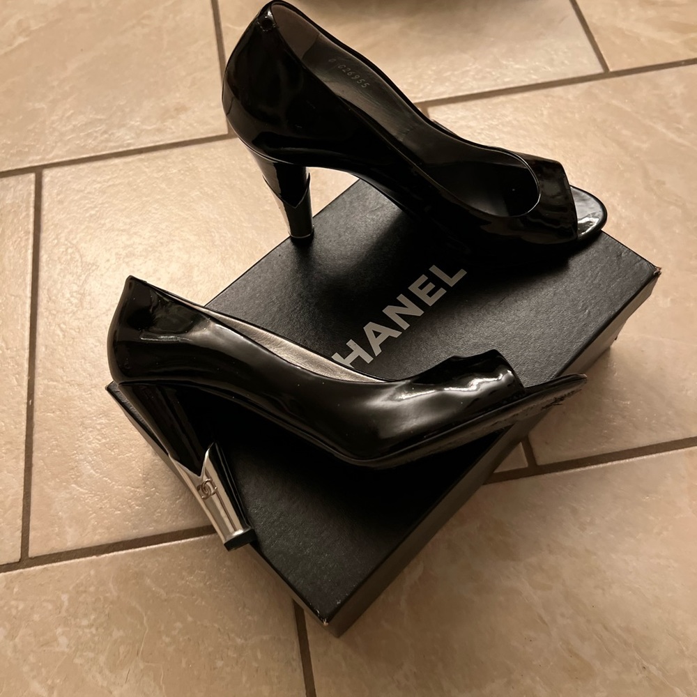 Chanel black pumps with silver on the Heels